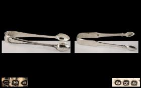 George III Pair of Silver Tongs of Large Proportions.