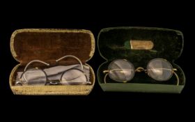 Two Pairs of Vintage Horn Rimmed Glasses, cased, with metal frames,