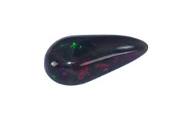 A Ethiopian Ruby Red Pear Shaped Opal length 20mm x 10mm x 5mm. Est carat weight 3.85.