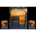 Child's Beechwood Roll Top Desk with three short drawers, mid century, made by Pegasus.