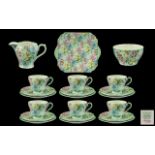 A Shelley 21 Piece Melody Tea Service comprising 6 trios, sugare, cream and bread and butter plate.