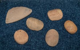 Five Stone Age Grinding Stones used on corn grinding, together with a piece from a grinding bowl,