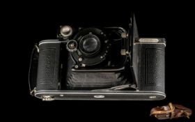 Zeiss Ikon Folding Camera in original brown leather case.