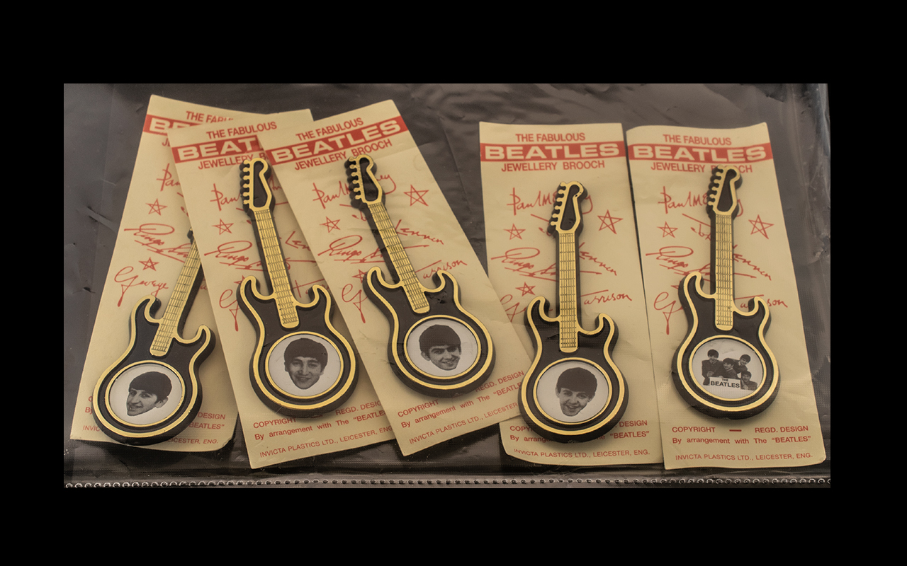 The Beatles Full Set of Original Beatles Brooches still on cards, issued by Invicta Ltd in 1964.