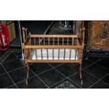 A 20th Century Babies Swinging Cradle mahogany finish, height 36'', length 38''.