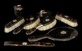 Eight Piece Victorian Lady's Dressing Table Set, in tortoiseshell with applied silver monograms.