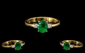 18ct Gold Attractive Emerald and Diamond Set Ring, the central, oval shaped,
