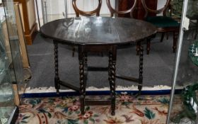 Edwardian Oak Gate-Leg Table supported on barley twist legs,