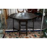 Edwardian Oak Gate-Leg Table supported on barley twist legs,