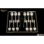 James Porter & Son ( Glasgow Retailers ) Boxed Set of 12 Silver Tea Spoons and Matching Sugar Nips.