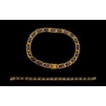 A 9ct Yellow Gold Attractive Blue Sapphire Set Line Bracelet, Set with 19 Blue Sapphires.