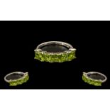 Peridot Five Stone Band Ring, five square cut peridots totalling 3.