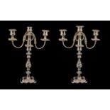 A Pair of Silver Plated Decorative Two Branch Three Light Candleabras of molded floral and scroll