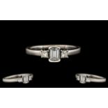 Contemporary Designed 18ct White Gold Diamond Set Ring. The emerald and princess cut diamonds of top