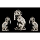 A Sterling Silver - Small Novelty Figure of a Monkey With its Right Hand to Top of Head,