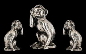 A Sterling Silver - Small Novelty Figure of a Monkey With its Right Hand to Top of Head,