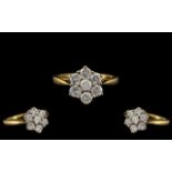 18ct Gold - Attractive Diamond Set Cluster Dress Ring. Flower head Setting. Marked 750 - 18ct. The