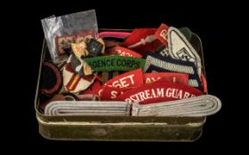 Collection of 60+ British Cloth Badges in a 1943 dated Chocolate & Boiled Sweets ration tin.