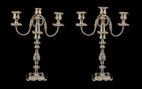 A Pair of Silver Plated Decorative Two B