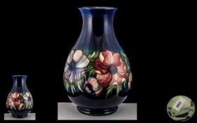 Large Moorcroft Bulbous Shaped Vase on a Blue Ground Body, Impressed Mark with Signature to Base.