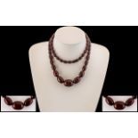Early 20th Century Long Graduated Cherry Coloured Bakelite Beaded Necklace of Good Colour.