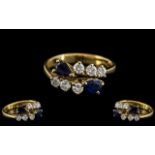 18ct Gold - Good Quality Sapphire and Diamond Set Dress Ring. Marked 750 - 18ct.
