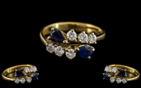 18ct Gold - Good Quality Sapphire and Diamond Set Dress Ring. Marked 750 - 18ct.