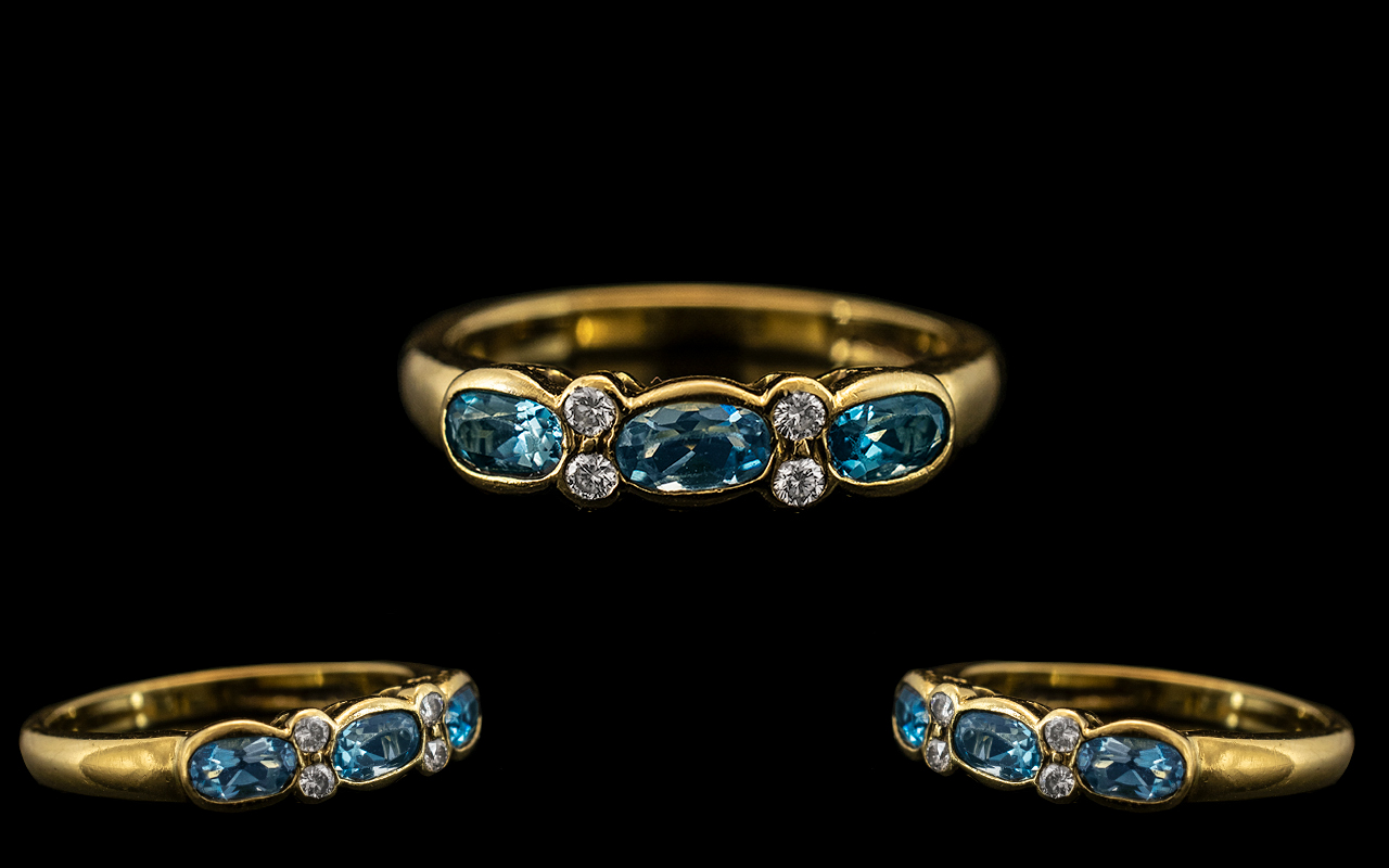 18ct Gold - Attractive Aquamarine and Diamond Set Ring of Pleasing Design.