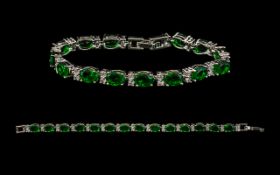 Emerald And Silver Tennis Bracelet. Fully Hallmarked For 925 Silver.