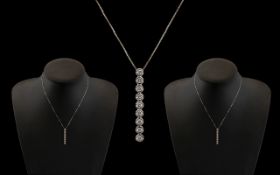 18ct White Gold - Attractive 10 Stone Diamond Set Pendant Drop with Attached 9ct White Gold Chain.