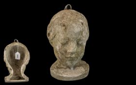 A Small French Plaster Bust of a young girl, indistinct letters and numbers inscribed on the sides.