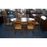 Teak Pull-Out Dining Table on baluster-shaped legs with cross stretchers.