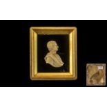 Early 19th Century Carved Wax Miniature of a Gentleman in classical garbe,