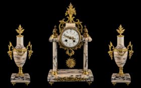 French - Late 19th Century Soft Pink and Black Marble Ormolu Mounted 8-Day Striking Portico Clock