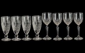 A Collection of Eight Waterford Drinking Glasses - comprising two sets of four cut glass wine