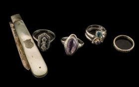 Four Vintage Silver Rings with amethysts and marcasites,