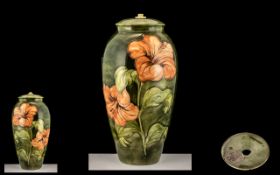 Large Moorcroft Hibiscus Pattern Lamp Base on a Green Body Ground,