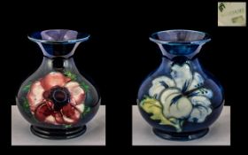 Moorcroft Pair of Small Tubelined Bulbous Shaped Vases 'Clematis' and 'White Hibiscus' design on