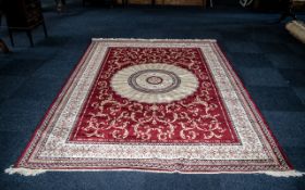 A Large Woven Silk Carpet Abusson rug with red ground and with traditional floral and foliate border