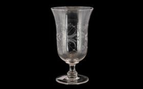 A Victorian Glass Celery Vase with etched decoration. Measures 8" in height.