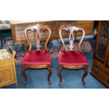 Pair of Victorian Mahogany Balloon Backed Chairs on cabriole legs, with red drop in seats.