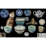 Eleven Various Oriental Items comprising a small tea pot, a small boy riding a water buffalo,