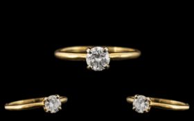 A Single Stone Diamond Ring, round modern brilliant cut diamond. Four claw setting, yellow gold.