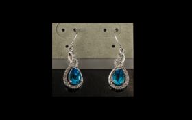 9ct White Gold Drop Earrings Set with Pear Shaped Blue Topaz & Diamond Chips, fully hallmarked.