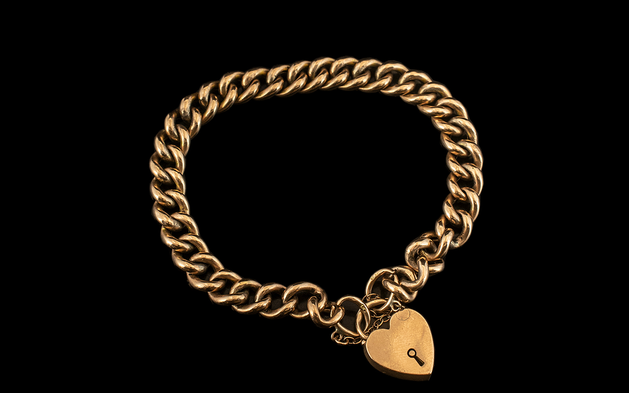 Late Victorian Period 9ct Gold Curb Bracelet with Attached 9ct Gold Heart Shaped Padlock.