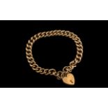 Late Victorian Period 9ct Gold Curb Bracelet with Attached 9ct Gold Heart Shaped Padlock.