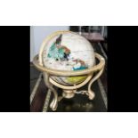 A Modern Gem Set Terrestrial Globe with Gilt Gimbel of typical form, diameter 13".