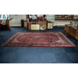 A Large Red Ground Persian Kashan Carpet traditional floral medallion. Measures 356 x 251 cms.