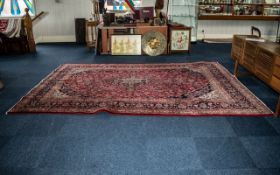 A Large Red Ground Persian Kashan Carpet traditional floral medallion. Measures 356 x 251 cms.