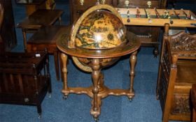 Italian Reproduction Floor Standing Globe Cocktail Cabinet with a lift up lid and fitted interior.